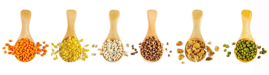 Set of wooden spoons with cereals and legumes. Isolated on white.