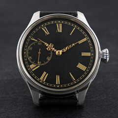 Elegant wristwatch featuring a black dial with gold Roman numerals and ornate golden hands....