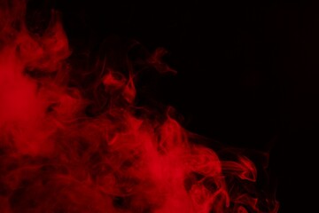 Hookah smoke in red light on black background, closeup. Space for text
