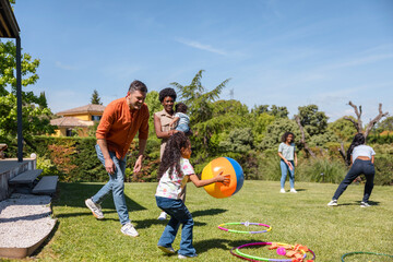 Family enjoying outdoor fun with kids playing games