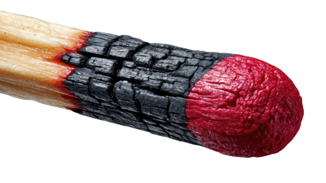 The Striking End: A close-up perspective of a burnt match head showcases the raw, untamed beauty of destruction, captured in exquisite detail.