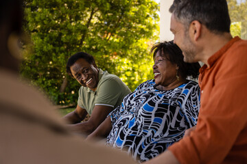 Group enjoying conversation outdoors on sunny day