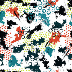 Dynamic seamless grunge pattern with abstract paint splashes, dots and brush strokes. Perfect for streetwear fashion, textile design and edgy artistic backgrounds.