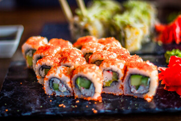 Girl eats Japanese vegetarian rolls