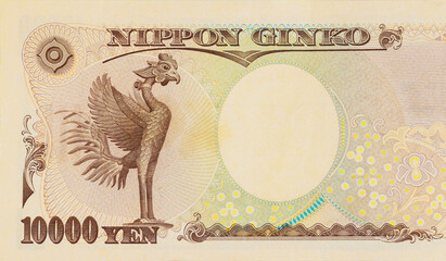 10000 yen banknote showing intricate details of phoenix, used in Japanese currency.