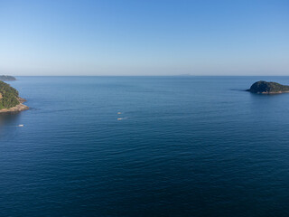 Beautiful island in the middle of the sea illuminated by the setting sun