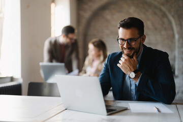 Businessman working on his desk in company