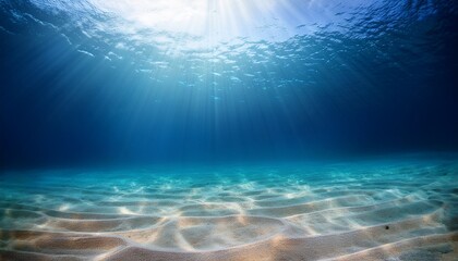 Naklejka premium underwater background deep blue sea and beautiful light rays with sandy floor