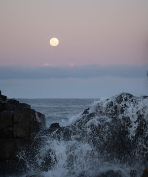 moon over sea at bombo