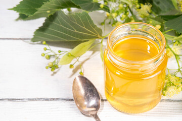 Linden jam, transparent golden floral jam, organic unusual herbal preserve sweets in small jar,...