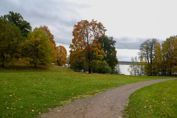 Colourful autumn landscape. Path in the city park of Lahti, Finland