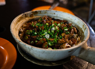 Chicken Clay Pot Garnished With Green Onions