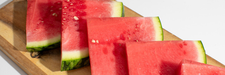 Crimson watermelon slices gleam on weathered oak, evoking midsummer picnics and the quirky zest of...