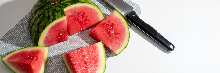 Juicy watermelon slices glow like crimson moons on summer solstice, picnic delight, tantalizing...
