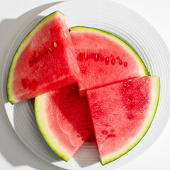 Slices of watermelon glisten like summer solstice jewels, inviting refreshing indulgence during La...