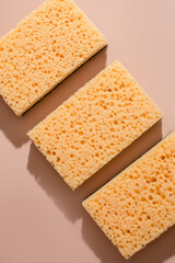 Porous sponge trio evokes tactile minimalism, oddly ordered cleanliness, Japanese Kanzo holiday renewal, geometric symmetry whispering serenity