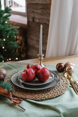 Serving a festive Christmas table in Scandinavian style. Decor on the table before the holiday.