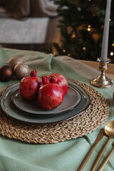 Serving a festive Christmas table in Scandinavian style. Decor on the table before the holiday.