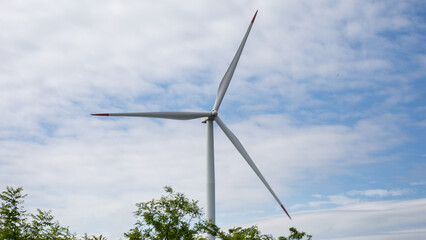 Whispering wind turbine against celestial canvas, energizing eco-symphony, green innovations, and...