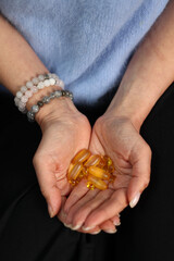 vitamins in women's palms. vitamins for health, omega 3, vitamin d