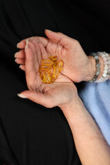 vitamins in women's palms. vitamins for health, omega 3, vitamin d