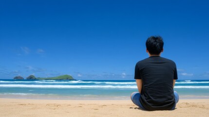 A peaceful ocean scene featuring a man in meditation beside calm waters