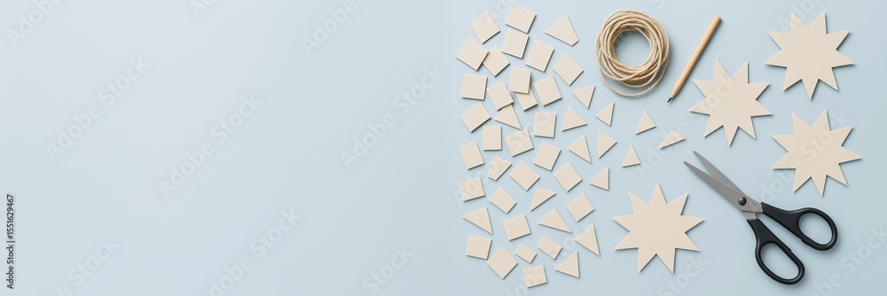 Poster Paper craft hobby tools and cutouts on light blue background with copyspace for DIY design or creative project template concept layout.