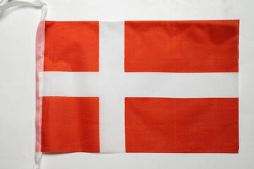 Fototapeta premium Closeup view of the Denmark national flag isolated over a white background. Concept of government and nationality