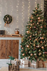Home New Year's interior. Christmas tree with gifts, decorated with garlands in the kitchen. Cozy atmosphere of a home holiday, loft design of the room, Scandinavian style.