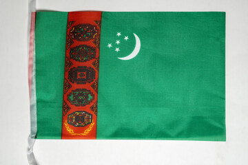 Closeup view of the Turkmenistan national flag isolated over a white background. Concept of government and nationality
