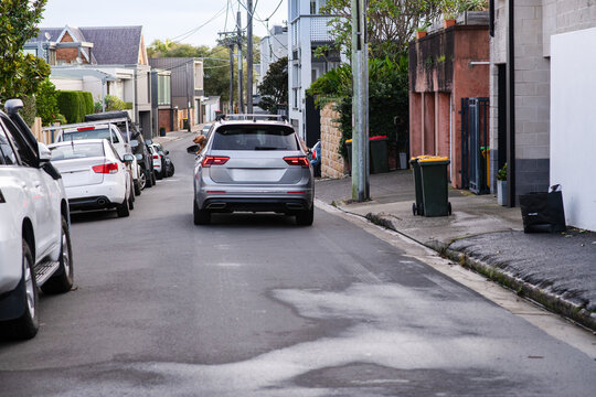 car driving down a narrow street in Sydney