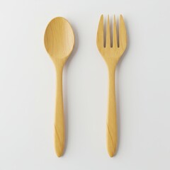 Wooden spoon and fork isolated on white background, eco-friendly reusable utensils for sustainable dining, natural kitchen tools, zero waste lifestyle, organic food styling accessories