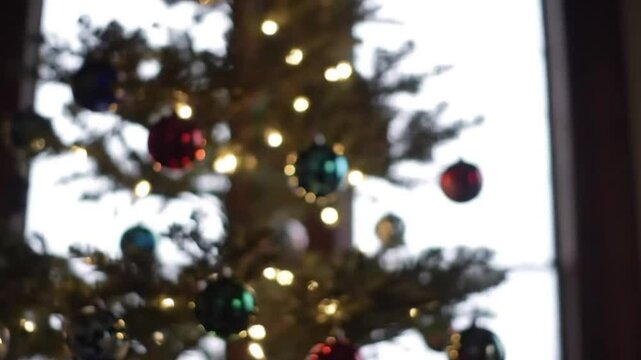 Blurred Ornaments and Lights on Christmas Tree - Abstract Holiday Background