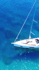 Sailing on Clear Blue Waters Captures the Essence of Summer Relaxation in a Picturesque Coastal...