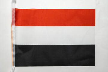 Closeup view of the Yemen national flag isolated over a white background. Concept of government and nationality
