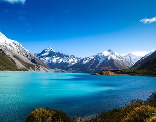 beautiful turquoise lake with snow capped mountains in the background blue sky new zealand landscape stunning natural scenery natural lighting high resolution photography