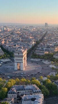 Experience the Stunning Aerial View of Paris with the Iconic Arc de Triomphe at Sunrise. Vertical video