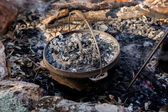 Camp oven in the ashes of a campfire