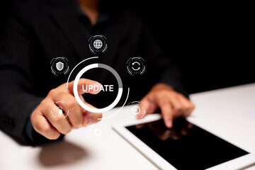 A person in a dark shirt touches a virtual interface with the word 