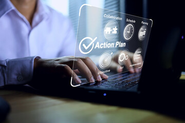Action plan concept with businessman working on laptop screen to manage and planning work to...