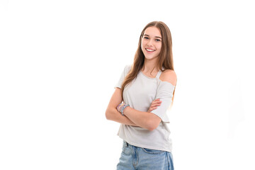 Portrait of teenage girl in casual t-shirt on light background in studio.