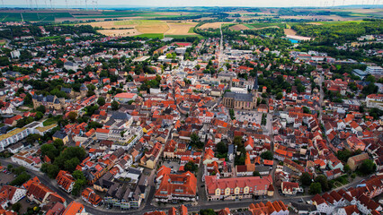 Aerial panorama view above the old town of the city Alzey in Germany on a sunny noon in spring	
