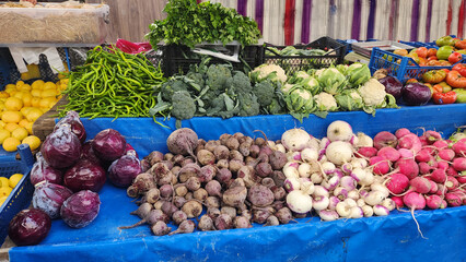 Fruits and vegetables in baskets and crates in the grocery section