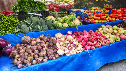 Fruits and vegetables in baskets and crates in the grocery section
