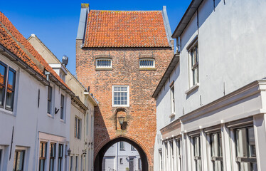 White houses in the street of the historic Gevangenpoort gate in Woudrichem, Netherlands