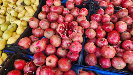Fruits and vegetables in baskets and crates in the grocery section