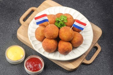 Bitterballen is the name of a type of food in the Netherlands. Bitterballen taste similar to croquettes, but are small round shapes about 3 to 4 cm