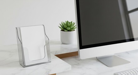 Minimalist workspace with computer, document holder, and succulent plant