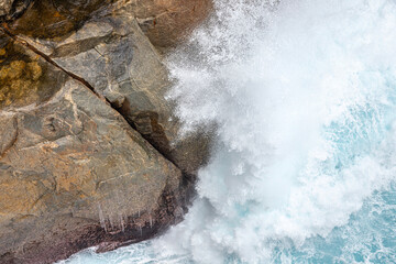 The Southern Ocean breaking on the entrance to The Gap in the Torndirrup National Park near Albany in the Shire of Denmark, Great Southern region of Western Australia, WA, Australia.