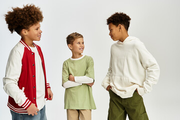 Cute little boys share laughter while showcasing vibrant styles and enjoying friendship moments